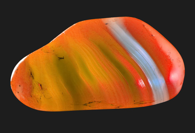 Buddha balancing on the water with the 7 Chakra colors.