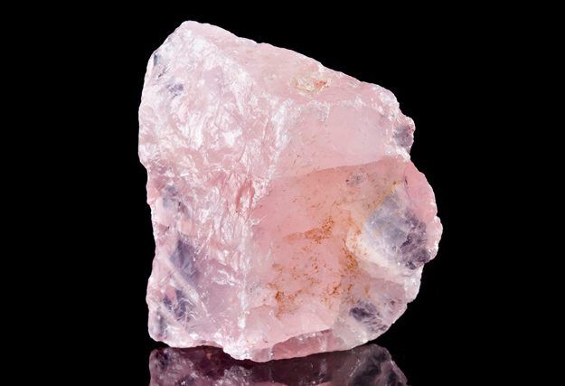 Buddha balancing on the water with the 7 Chakra colors.